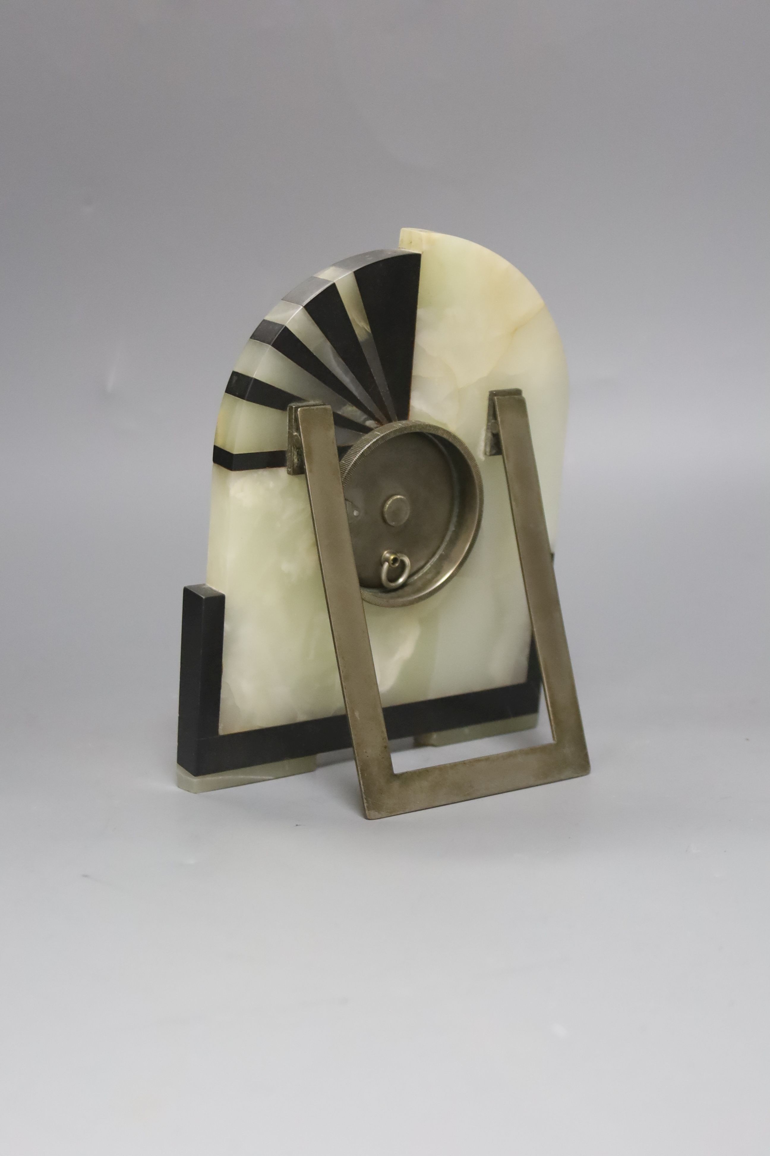 An Art Deco black marble and pale green mantel clock, 19cm high